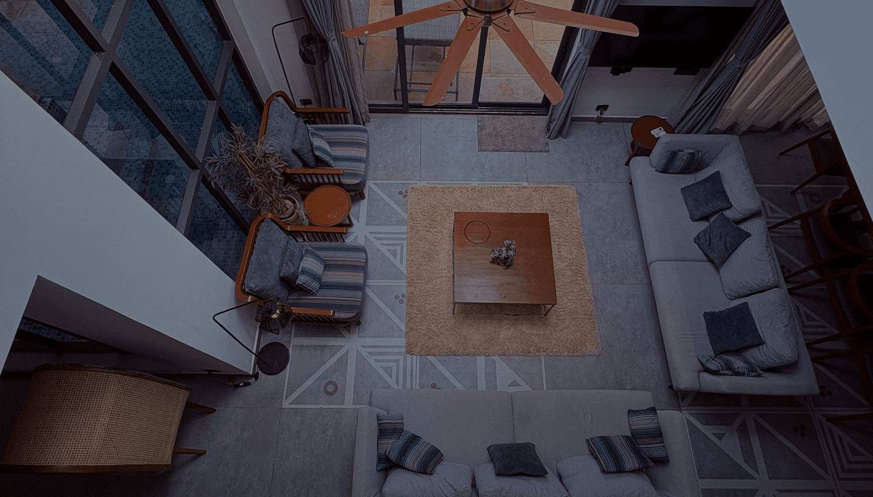 A refined villa living room viewed from the floor above