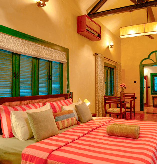 A colourful premium bedroom managed by The Greendoor Villa